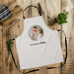 Minimalistic Photo | Grandma's Kitchen Gift<br><div class="desc">This charming apron is the perfect gift for any beloved grandma who loves spending time in the kitchen. Featuring a minimalistic design with a personal touch, this apron includes a photo of your choice to make it truly unique. Whether she's baking cookies or preparing a family feast, this apron will...</div>