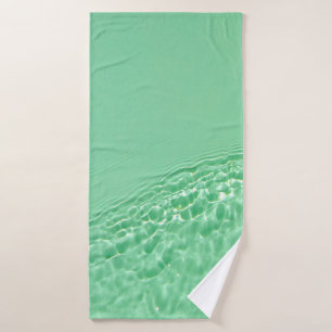 Mint blue coloured clear water surface texture wit bath towel