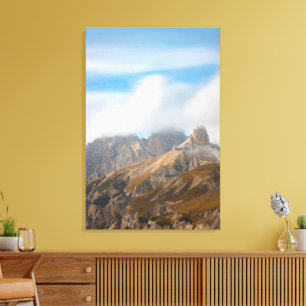 Misty clouds over the autumn orange dolomites canvas print