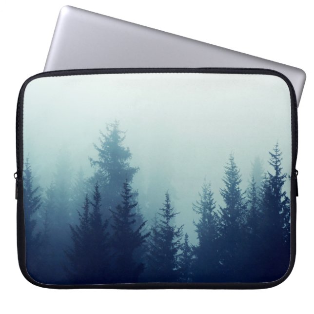 Misty fog in pine forest on mountain slopes. Colou Laptop Sleeve (Front)