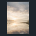Misty Lake Sunrise Golden Reflection Poster<br><div class="desc">Soft golden sunlight pierces through thick morning mist over a calm lake, creating a luminous path of reflection across the water. Tall reeds line the shore while distant trees fade into the haze, and the sky blends warm peach and rose tones into pale blue-gray. The composition radiates profound stillness, gentle...</div>