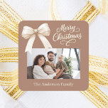 Mocha coffee cream bow photo script Christmas Square Sticker<br><div class="desc">A muted mocha coffee background,  cream coloured text and a bow. Merry Christmas is written with an elegant hand-lettered style font. Personalise and add your family name.</div>