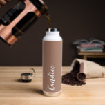 Mocha Personanlized Wedding Bridesmaid Water Bottle<br><div class="desc">Gift your wedding bridesmaid or maid of honour with this trendy, vacuum Insulated water bottle that features her name in white, stylised script on a trendy mocha brown colour background designed to match your wedding colour scheme. Personalise bottle by editing and replacing name with your own as desired. Select your...</div>