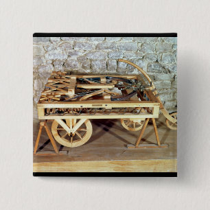 Model of a car driven by springs 15 cm square badge