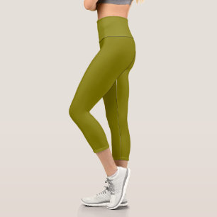 model wearing fitted olive-green leggings