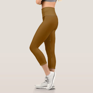 model wearing form-fitting brown leggings