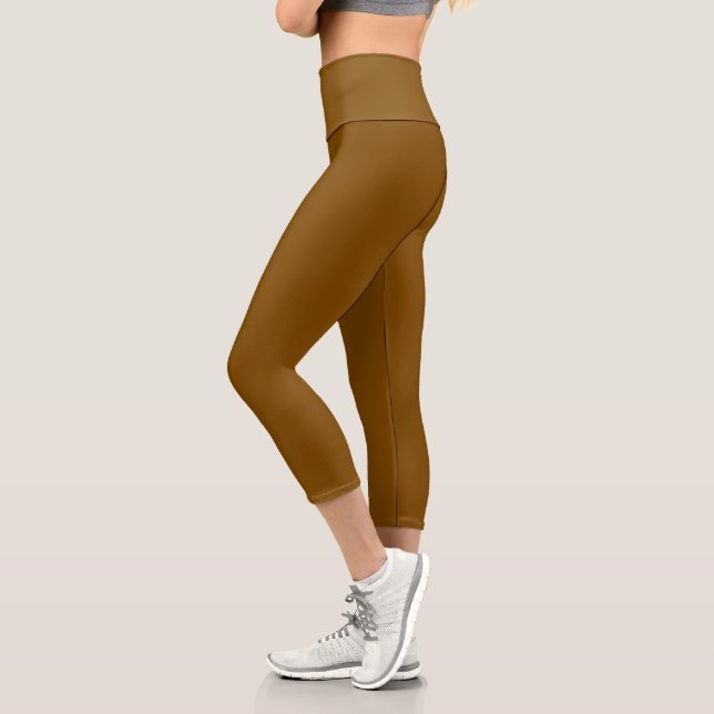 model wearing form-fitting brown leggings (Left)