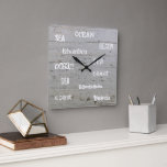 Modern beach wood ocean script family name square wall clock<br><div class="desc">Rustic summer ocean beach clock with driftwood background and sea,  ocean,  beach handwritten script.
You can add your own name to personalise.</div>