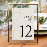 Modern Black and Ivory Monogram Minimalist Wedding Table Number<br><div class="desc">Guide your guests with elegance and style using the Modern Black and Ivory Monogram Minimalist Wedding Table Number, a sophisticated detail designed to complement a refined and contemporary wedding celebration. Featuring a timeless black and ivory color palette paired with clean minimalist typography, this table number design brings clarity and visual...</div>