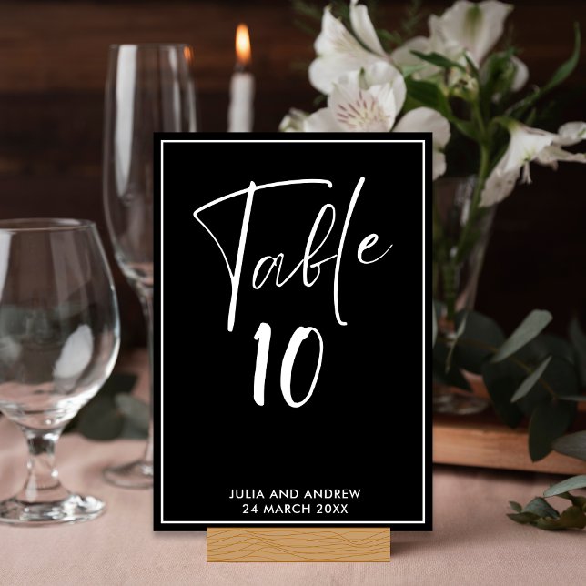 Modern Black and White Minimalist Script Wedding Table Number (Creator Uploaded)