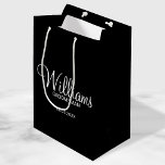Modern Black and White Personalised Groomsman Medium Gift Bag<br><div class="desc">Modern Black and White Personalised Groomsman Gifts
featuring personalised groomsman's name in white modern script font style with title and wedding date in modern sans serif font style on black background.

Also perfect for best man,  father of the bride,  bridesmaid,  maid of honour,  mother of the bride and more.</div>