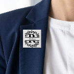 Modern Black Floral Wreath Split Monogram "R" 15 Cm Square Badge<br><div class="desc">This refined floral split monogram wreath design features a delicate botanical arrangement forming a graceful circular frame around a customizable monogram "R". The balanced composition highlights elegant leaves and floral accents that create a timeless and sophisticated look. Perfect for personalized gifts, and accessories, this design blends classic monogram style with...</div>