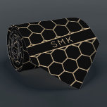 Modern Black Gold Foil Geometric Monogram Tie<br><div class="desc">Modern Black and Gold Foil Geometric Monogram Necktie in a stylish pattern of gold hexagons on an elegant black background. Easy to customise with text, fonts, and colours. Created by Zazzle pro designer BK Thompson © exclusively for Cedar and String; please contact us at cedarandstring@gmail.com if you need assistance, have...</div>