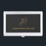 Modern Black Monogram Business Card Holder<br><div class="desc">Keep your business cards organised and stylish with this modern black business card case. The design features a golden monogram and text,  adding a personal touch to your professional look. This case is perfect for carrying in your bag or briefcase,  and makes a great gift for colleagues and clients.</div>