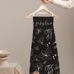 Modern Black White Floral lineart personalised Apron<br><div class="desc">Elevate your kitchen style with this Modern Black White Floral Line Art Personalised Apron. Featuring a sleek, minimalist black and white floral line art design, this apron brings elegance and sophistication to any cooking or baking experience. Customise with your name, making it the perfect personalised gift for bakers, chefs, or...</div>