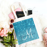 Modern Blue Glitter Sparkles Personalized Name Tote Bag<br><div class="desc">Introducing our Modern Blue Glitter Sparkles Personalized Name collection, exclusively available on Zazzle! This dazzling product line is perfect for adding a touch of glamour and customization to your everyday essentials. Embrace the modern and glamorous vibes of our Modern Blue Glitter Sparkles Personalized Name collection, available exclusively on Zazzle. With...</div>