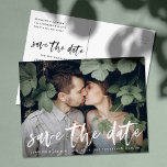 Modern Brushed Script Photo Save The Date Announcement Postcard<br><div class="desc">Elegant and modern save the date postcard featuring a white modern hand-lettered script font overlay. Personalise the modern save the date cards by adding your names,  wedding details,  and favourite engagement photo. The photo used in this design is for display purposes only and is not for resale.</div>