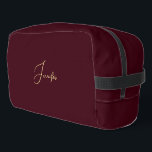 Modern Burgundy Gold Monogram Gym Travel Cosmetic Dopp Kit<br><div class="desc">Create your own custom, personalised, beautiful modern elegant faux gold script / typography monogram monogrammed, durable Polyester Poplin, sturdy polyester fabric mens womens kids solid plain dark burgundy brown cosmetic makeup toiletry organiser golf beach accessory gym travel dopp kit bag pouch with a zippered closure, two interior mesh pockets -...</div>
