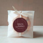 Modern Burgundy Monogram Minimalist Wedding Classic Round Sticker<br><div class="desc">Add a charming finishing touch to your wedding stationery with the Modern Burgundy Monogram Minimalist Wedding Classic Round Sticker, a stylish detail designed to bring elegance and personality to every envelope, favor, and decorative element of your celebration. This beautifully balanced sticker features a rich burgundy color palette paired with clean...</div>