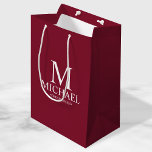 Modern Burgundy Red Personalised Groomsman Medium Gift Bag<br><div class="desc">Modern Burgundy Red Personalised Groomsman Gifts
featuring personalised monogram,  groomsman's name and title in white classic serif font style on burgundy red background.

Also perfect for Best Man,  Father of the Bride and more.</div>