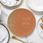 Modern Burnt Orange Gold Glitter Edge Wedding Paper Plate<br><div class="desc">The left-hand edge of these elegant modern wedding paper plates features a gold faux glitter design. Personalise them with the names of the bride and groom in pale gold-coloured handwriting script over a large ampersand on a burnt orange background,  with the wedding date below.</div>