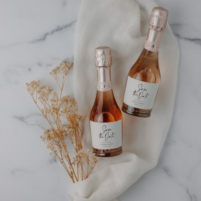 Modern casual script black save the date wedding sparkling wine label (Creator Uploaded)