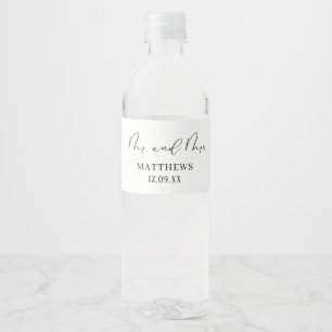 Modern chic black calligraphy script Mr and mrs Water Bottle Label