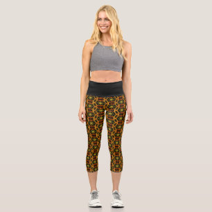 Modern chic orange bicycle wheels pattern black capri leggings