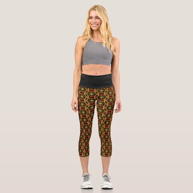 Modern chic orange bicycle wheels pattern black capri leggings (Front)