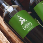 Modern Christmas Tree on Green Wine Label<br><div class="desc">Modern tree,  stars,  Merry Christmas and your names in chic lettering on a green background,  personalise these wine bottle labels to serve at your holiday party or to give as gifts or party favours for business gifts,  corporate gifts. CHANGE the background colour to anything.</div>