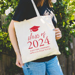 Modern Class of 2024 Red Script Graduation Tote Bag<br><div class="desc">Give the grad a personalised gift they will use! The graduation tote bag features a red graduation cap at the top of the design with "Class of 2024" displayed in bold red lettering. Personalise the red graduation tote bag with the graduate's name, school, and graduation year. The design repeats on...</div>