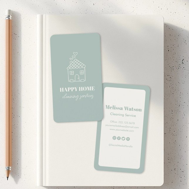 Modern Cute Stylish House Cleaning Service Maid  Business Card (Two business cards on a white notebook. One card has a house sketch with Happy Home Cleaning Service)