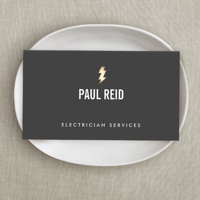 Modern Electrician Gold Lightning Bolt Logo Black Business Card (Creator Uploaded)