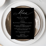 Modern Elegant Black and White Calligraphy Wedding Menu<br><div class="desc">This elegant wedding menu features the word "Menu" in graceful white calligraphy against a chic black background, offering a sophisticated look for your special day. Personalise it by adding your names, wedding date, and a detailed menu in bold white lettering. The modern, simple, and elegant design is perfect for both...</div>