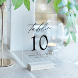 Modern Elegant Black Script Acrylic Table Number<br><div class="desc">Elevate your wedding decor with our Modern Elegant Black Script Acrylic Wedding Table Number Cards. These sleek, stylish cards showcase modern black lettering with 'Table' displayed in chic calligraphy script, set against a frosted or transparent acrylic background for a sophisticated, minimalist look. Personalise each card with your names, wedding date,...</div>