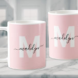 Modern Elegant Blush Pink Monogram Coffee Mug<br><div class="desc">Personalised Modern Feminine Blush Pink Initial Name Monogram Coffee Mug. This stylish mug features a bold blue initial over a soft blush pink background, complemented by an elegant black script name. The monogram is displayed on both sides, adding a chic, personalised touch from every angle. With its modern minimalist design...</div>