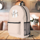 Modern Elegant Blush Pink Monogram Printed Backpack<br><div class="desc">A handwritten monogram design in an elegant style in black informal casual script typography over a blush bold pink initial oversized letter. The text can easily be customised for a design as unique as you are!</div>