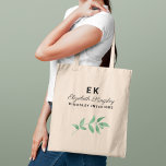 Modern Elegant Greenery Custom Name and Business Tote Bag<br><div class="desc">This stylish professional tote bag design is perfect for a small business owner or employee. Features the first and last name initials, the name in modern calligraphy script with classic and elegant text that can be personalised with a job title or business name, as well as a botanical greenery branch...</div>