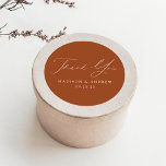 Modern Elegant Terracotta Wedding Thank You Classic Round Sticker<br><div class="desc">Elegant wedding stickers displaying "Thank You" in a beautiful white calligraphy script with a terracotta background or colour of your choice. Personalise the modern thank you stickers with your names and wedding date. The terracotta wedding thank you stickers are perfect to use for sealing thank you card envelopes, wedding favour...</div>