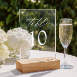 Modern Elegant White Script Acrylic Table Number<br><div class="desc">Elevate your wedding decor with our Modern Elegant White Script Acrylic Wedding Table Number Cards. These sleek, stylish cards showcase modern white lettering with 'Table' displayed in chic calligraphy script, set against a frosted or transparent acrylic background for a sophisticated, minimalist look. Personalise each card with your names, wedding date,...</div>