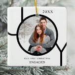 Modern First Christmas Engaged Photo Ceramic Ornam Ceramic Ornament<br><div class="desc">This modern First Christmas Engaged Photo Ornament is decorated with the word JOY in black on a white background.
Easily customizable with your photo and name.</div>