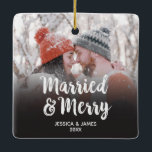 Modern First Christmas Married and Merry Photo Ceramic Ornament<br><div class="desc">An elegant white script photo christmas ornament with the words,  Married and Merry. Personalise it with your names,  your wedding date,  and a photo. Same design on front and back. Designed for you by Blackberry Boulevard.</div>