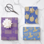 Modern Gold Menorah Dreidel Olive Branch Dove Wrapping Paper Sheet<br><div class="desc">Modern Hanukkah wrapping paper featuring colourful shades of bluish purple paper with modern gold menorahs on one, dancing gold dreidels on another and gold flying doves carrying an olive branch; that same dove that returned to Noah's arc carrying the olive branch symbolic of dry land, peace with god, innocence and...</div>