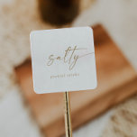 Modern Gold Script Salty Wedding Favour Square Sticker<br><div class="desc">These modern gold script salty wedding favour stickers are perfect for a minimalist wedding. The simple yellow gold colour design features unique industrial lettering typography with modern boho style. Customisable in any colour. Keep the design minimal and elegant, as is, or personalise it by adding your own graphics and artwork....</div>