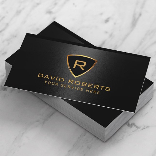 Modern Gold Shield Monogram Logo Black Metallic Business Card (Creator Uploaded)