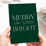 Modern Green Merry and Bright Non-Photo Holiday Card<br><div class="desc">Modern holiday card featuring "Merry and Bright" displayed in white lettering and a dark green background with subtle white dots (snow). Personalize the front of the non-photo holiday card with your family name and the year in white lettering. The card reverses to display your personal message in green lettering or...</div>