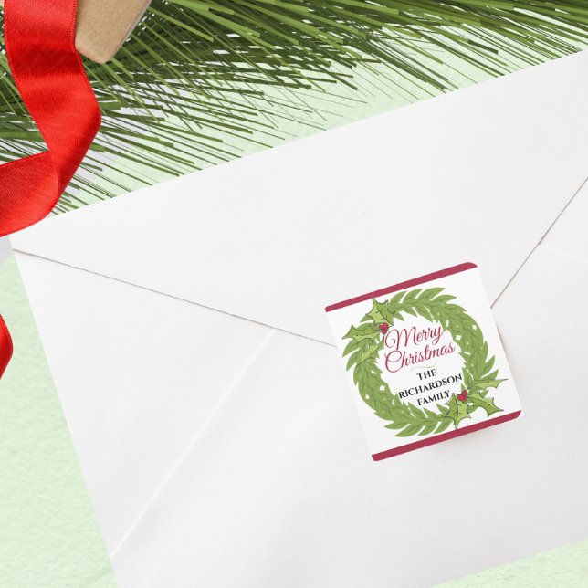 Modern Green Wreath Merry Christmas Personalized Square Sticker (Modern Green Wreath Merry Christmas Personalized Square Sticker holiday envelope card label)