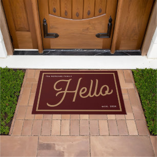 Modern Hello Burgundy Gold Script Family Name Doormat