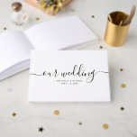Modern Minimal Elegant Chic Handwritten Wedding Guest Book<br><div class="desc">This simple,  modern calligraphy guest book is perfect for a beautiful,  chic wedding. The sophisticated black and white design features your names and wedding date in minimalist typography alongside a romantic and whimsical handwritten script.</div>