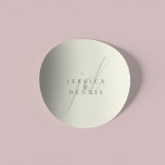 Modern Minimal Elegant Script Monogram Wedding Classic Round Sticker<br><div class="desc">Modern Minimal Elegant Script Monogram Wedding Classic Round Sticker Add a touch of elegance to your wedding with these modern, minimalist, and elegant script monogram classic round stickers. Crafted in classic ivory and storm dust colours, these stickers are perfect for sealing invitations, favour bags, or adding a personalised touch to...</div>